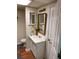 Basement bathroom with white vanity and gold framed mirror at 1886 Clay Sw Dr, Marietta, GA 30064