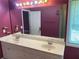 Double sink vanity, large mirror, and soft lighting at 1886 Clay Sw Dr, Marietta, GA 30064