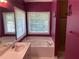 Bright bathroom features a soaking tub, window, and tiled floor at 1886 Clay Sw Dr, Marietta, GA 30064