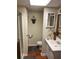 Bathroom featuring a white sink, cabinet, toilet, and walk-in shower at 1886 Clay Sw Dr, Marietta, GA 30064