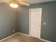 Neutral carpeted bedroom features a ceiling fan and painted walls at 1886 Clay Sw Dr, Marietta, GA 30064