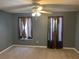 This bedroom features neutral carpet and window light at 1886 Clay Sw Dr, Marietta, GA 30064