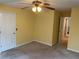 Cozy bedroom with neutral carpet and fan lighting at 1886 Clay Sw Dr, Marietta, GA 30064