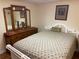 Cozy bedroom with white headboard and dresser, perfect for relaxation at 1886 Clay Sw Dr, Marietta, GA 30064