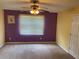 Bedroom with neutral carpeting, neutral paint, and ceiling fan at 1886 Clay Sw Dr, Marietta, GA 30064
