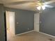 Bedroom with fan, carpeting, and door to hallway at 1886 Clay Sw Dr, Marietta, GA 30064