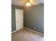 Carpeted bedroom features neutral decor, a ceiling fan, and ample natural light at 1886 Clay Sw Dr, Marietta, GA 30064