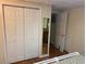 Bedroom features a closet with white folding doors and a mirrored wall at 1886 Clay Sw Dr, Marietta, GA 30064