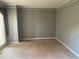 Neutral-toned bedroom with plush carpeting, large window for natural light, and minimal decor at 1886 Clay Sw Dr, Marietta, GA 30064