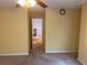 Bedroom featuring neutral colors, carpet, ceiling fan, and door to the hallway at 1886 Clay Sw Dr, Marietta, GA 30064
