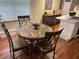Dining area features marble table, four chairs and stainless steel appliances at 1886 Clay Sw Dr, Marietta, GA 30064