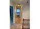 Long carpeted hallway connects rooms with neutral colors at 1886 Clay Sw Dr, Marietta, GA 30064