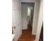 Hallway view reveals a tiled floor and white door leading to other rooms at 1886 Clay Sw Dr, Marietta, GA 30064