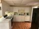 Bright kitchen with white cabinets, stainless steel appliances and wood-look floors at 1886 Clay Sw Dr, Marietta, GA 30064