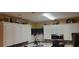 Kitchen with white cabinets and tile backsplash at 1886 Clay Sw Dr, Marietta, GA 30064