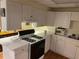 Bright kitchen with white cabinets, stainless steel appliances and wood-look floors at 1886 Clay Sw Dr, Marietta, GA 30064