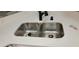 Double stainless steel sink with white countertop at 1886 Clay Sw Dr, Marietta, GA 30064