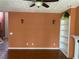 Spacious living room with hardwood floors, sconce lighting, built-in shelving and neutral paint at 1886 Clay Sw Dr, Marietta, GA 30064