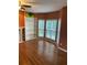 Hardwood-floored living room with fireplace, built-in shelves, and bright windows creating a cozy atmosphere at 1886 Clay Sw Dr, Marietta, GA 30064