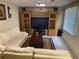 Cozy living room features large television, entertainment center and comfortable L-shaped couch at 1886 Clay Sw Dr, Marietta, GA 30064