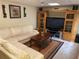 Cozy living room features large television, entertainment center and comfortable L-shaped couch at 1886 Clay Sw Dr, Marietta, GA 30064