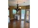 Bright office nook with built-in desk, modern lighting, and seamless transition to the dining area at 1886 Clay Sw Dr, Marietta, GA 30064