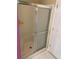 Shower with sliding glass door and tile floor at 1886 Clay Sw Dr, Marietta, GA 30064