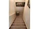 Carpeted stairs leading downstairs with a patterned cushion at 1886 Clay Sw Dr, Marietta, GA 30064