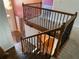 Staircase with dark wood and wrought iron railing at 1886 Clay Sw Dr, Marietta, GA 30064