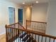 Stairway with wooden railings leading to the upper level at 1886 Clay Sw Dr, Marietta, GA 30064