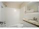 Clean bathroom with white tiled walls and granite top vanity at 1967 Glen Echo Dr, Decatur, GA 30032