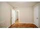 Spacious bedroom with hardwood floors and access to hallway at 1967 Glen Echo Dr, Decatur, GA 30032