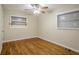 Hardwood floor bedroom with ceiling fan and window blinds at 1967 Glen Echo Dr, Decatur, GA 30032
