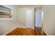 Bedroom with hardwood floors, closet, and access to hallway at 1967 Glen Echo Dr, Decatur, GA 30032