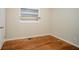 Simple bedroom with hardwood floors and window at 1967 Glen Echo Dr, Decatur, GA 30032