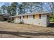 Side view of brick ranch house needing some repairs at 1967 Glen Echo Dr, Decatur, GA 30032