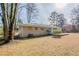 Brick ranch house with a patio and yard at 1967 Glen Echo Dr, Decatur, GA 30032