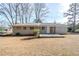 Brick ranch house with a patio and yard at 1967 Glen Echo Dr, Decatur, GA 30032