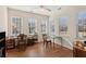 Sunroom with hardwood floors, ample windows, and workspace at 2565 Grapevine Cir # 103, Cumming, GA 30041