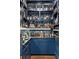 Well-stocked home bar with extensive shelving and cabinetry at 571 Glen Eagles Se Cir, Marietta, GA 30067