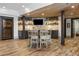 Basement bar with seating area and wine rack at 571 Glen Eagles Se Cir, Marietta, GA 30067
