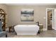 Spa-like bathroom featuring a freestanding tub and modern fixtures at 571 Glen Eagles Se Cir, Marietta, GA 30067
