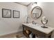 Bathroom with a round mirror and a dark brown vanity at 571 Glen Eagles Se Cir, Marietta, GA 30067