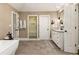 Elegant bathroom with soaking tub, walk-in shower, and double vanity at 571 Glen Eagles Se Cir, Marietta, GA 30067