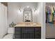 Modern bathroom with dark vanity, tile flooring and walk-in closet at 571 Glen Eagles Se Cir, Marietta, GA 30067