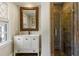 Small bathroom with a walk-in shower and ornate mirror at 571 Glen Eagles Se Cir, Marietta, GA 30067