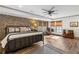 Spacious bedroom with brick accent wall and king-size bed at 571 Glen Eagles Se Cir, Marietta, GA 30067