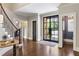 Spacious entry with hardwood floors, a staircase, and a view of the office at 571 Glen Eagles Se Cir, Marietta, GA 30067