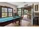 Game room with pool table and French doors leading to the outdoors at 571 Glen Eagles Se Cir, Marietta, GA 30067