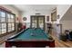 Basement game room with pool table and access to patio at 571 Glen Eagles Se Cir, Marietta, GA 30067